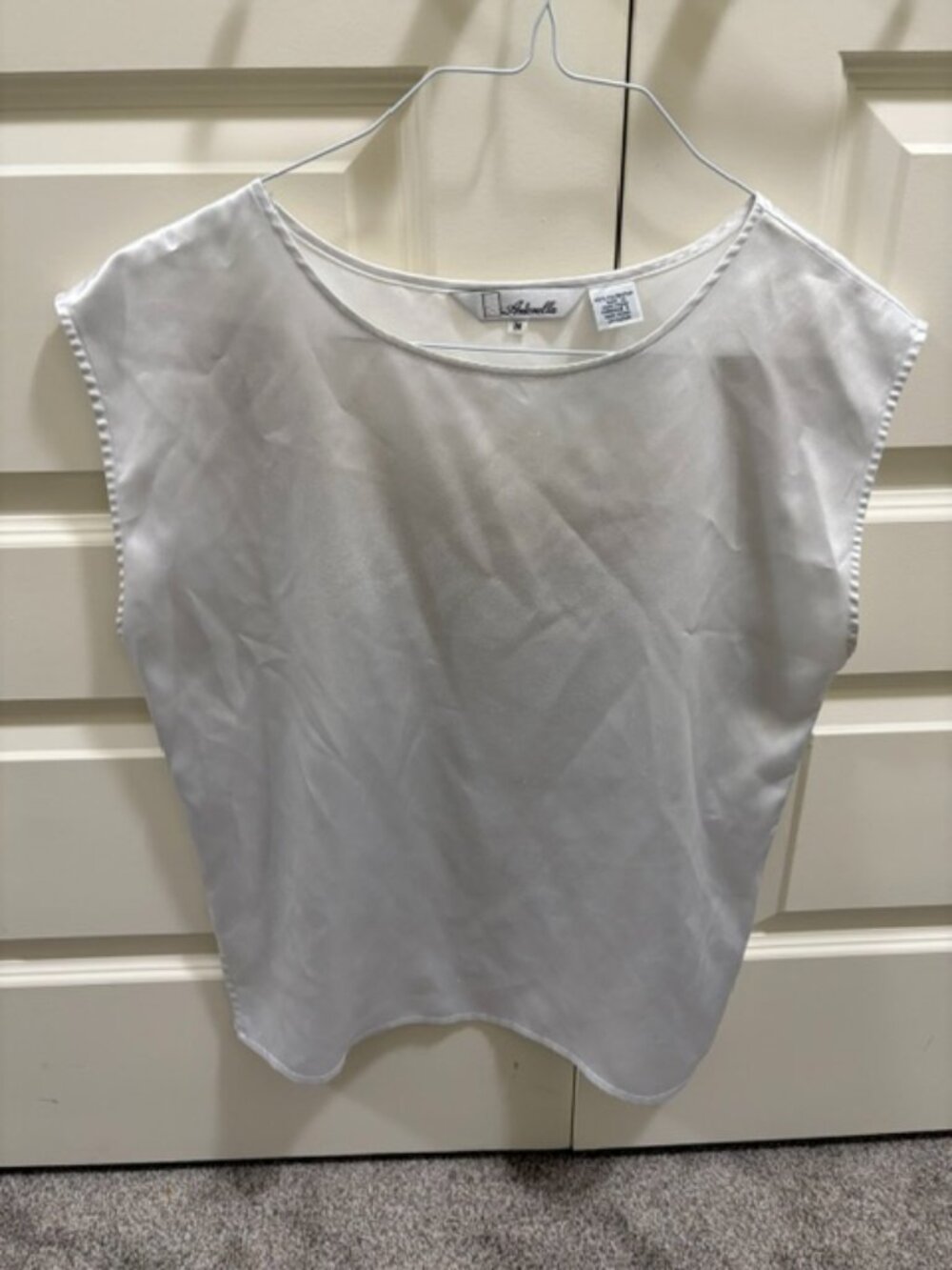 White sleeveless blouse